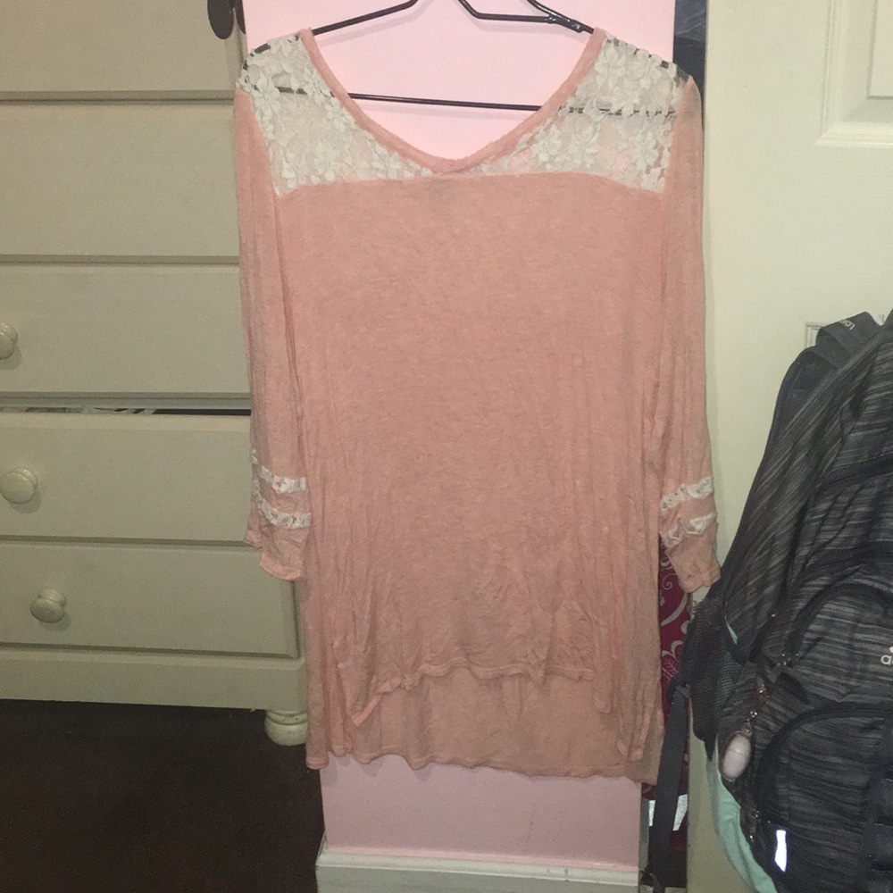 long peached colored shirt